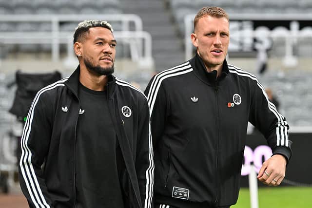 Newcastle United's Brazilian midfielder #07 Joelinton (L) abd Newcastle United's English defender #33 Dan Burn arrive ahed of the English League Cup fourth round football match between Newcastle United and Tottenham Hotspur at St James' Park in Newcastle-upon-Tyne, north east England on October 29, 2025. (Photo by ANDY BUCHANAN / AFP)