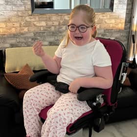 Seren-Grace Brady smiles for the photo at her home. She is one of only 250 children in the world with a rare syndrome.