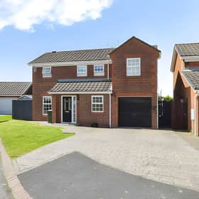 The frontage welcomes buyers to a detached family home in one of the area's sought-after residential developments