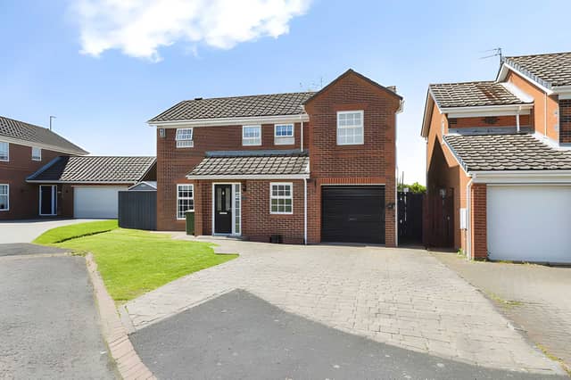 The frontage welcomes buyers to a detached family home in one of the area's sought-after residential developments