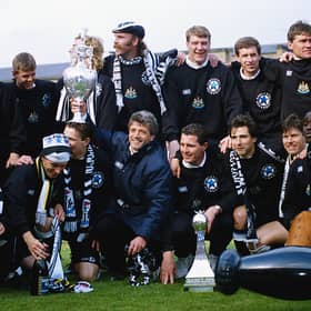 Newcastle United manager Kevin Keegan holds the League Division One trophy after the League Division One match against Leicester City at St James' Park on May 9, 1993 in Newcastle, England,( Back row left to right) Paul Bracewell, Terry McDermott (Assistant manager) Mark Robinson, Barry Venison (obscured) Brian Kilcline, Tommy Wright, Kevin Sheedy, Derek Fazackerley (coach) Derek Wright (physio) and Scott Sellars, (front row left to right) John Beresford, Lee Clark, David Kelly, Steve Howey (partially obscured) KK, Liam O' Brien, Gavin Peacock, Robert Lee, Andy Cole and Kevin Scott. (Photo by Stevie Morton/Allsport/Getty Images)