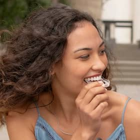 Invisalign aligners being attached.