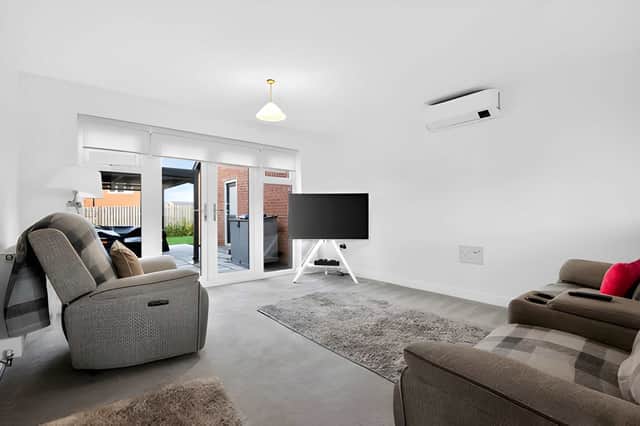 A spacious living room provides a welcoming setting for relaxing with family or hosting guests.