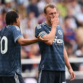 Will Osula (l) and captain Dan Burn of Newcastle United in discussion during the pre-season friendly match between Newcastle United and Strasbourg at St James' Park on August 16, 2026 in Newcastle upon Tyne, England. (Photo by Stu Forster/Getty Images)