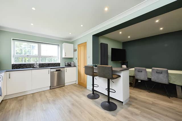 An open-plan kitchen diner with breakfast bar forms the sociable centre of the ground floor