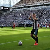 Newcastle United's English midfielder #03 Lewis Hall applauds as he goes to take a corner during the English Premier League football match between Newcastle United and Liverpool at St James' Park in Newcastle-upon-Tyne, north east England on August 23, 2026. (Photo by Paul ELLIS / AFP via Getty Images) 