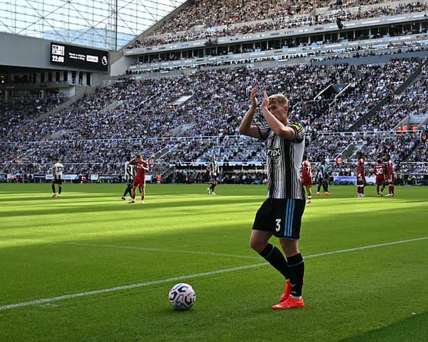 Newcastle United's English midfielder #03 Lewis Hall applauds as he goes to take a corner during the English Premier League football match between Newcastle United and Liverpool at St James' Park in Newcastle-upon-Tyne, north east England on August 23, 2026. (Photo by Paul ELLIS / AFP via Getty Images) 
