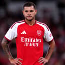 Arsenal midfielder Bruno Guimaraes stands with his hands on his hips