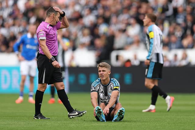 An injured Sean Steur of Newcastle United reacts before leaving the fiel during the Premier League 2026/27 match between Newcastle United and Hull City at St James' Park on September 19, 2026 in Newcastle upon Tyne, England. (Photo by Stu Forster/Getty Images)