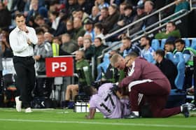 Matthias Jaissle, Manager of Newcastle United, looks across as Bazoumana Toure of Newcastle United receives medical attention after sustaining an injury during the Premier League 2026/27 match between Coventry City and Newcastle United at The Coventry Building Society Arena on October 12, 2026 in Coventry, England. (Photo by Dan Istitene/Getty Images)