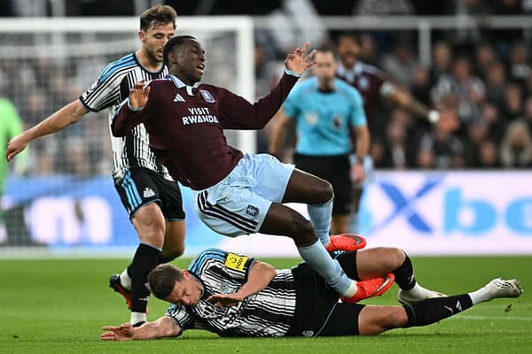Newcastle United's Dutch defender #04 Sven Botman (down) fouls Aston Villa's Senegalese striker #11 Nicolas Jackson (up) during the English Premier League football match between Newcastle United and Aston Villa at St James' Park in Newcastle-upon-Tyne, north east England on October 17, 2026. (Photo by Paul ELLIS / AFP via Getty Images)