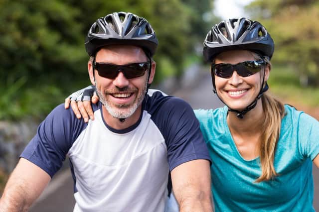 Wearing wraparound sunglasses while cycling helps keep pollen out of your eyes (photo: adobe)