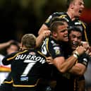 Jordan Tansey is mobbed by team-mates after his late winning try for Leeds Rhinos against Bradford Bulls at the first Magic Weekend in Cardiff back in 2007: Picture: Gareth Copley/PA Wire.