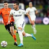 Jack Harrison on the charge from his left back role.