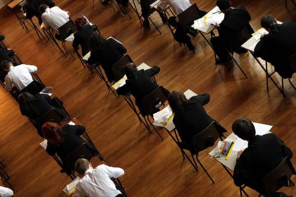 File photo dated 02/03/2012 of a math exam in progress at Pittville High School, Cheltenham. Teenagers across the country are waking up to their GCSE results in a year when the proportion of top grades awarded is expected to fall. Issue date: Thursday August 24, 2023.