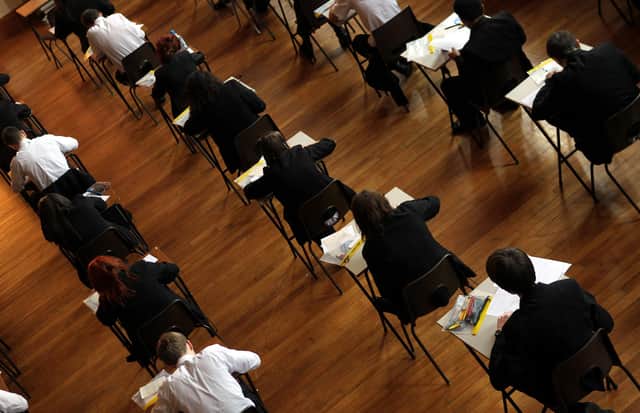 File photo dated 02/03/2012 of a math exam in progress at Pittville High School, Cheltenham. Teenagers across the country are waking up to their GCSE results in a year when the proportion of top grades awarded is expected to fall. Issue date: Thursday August 24, 2023.