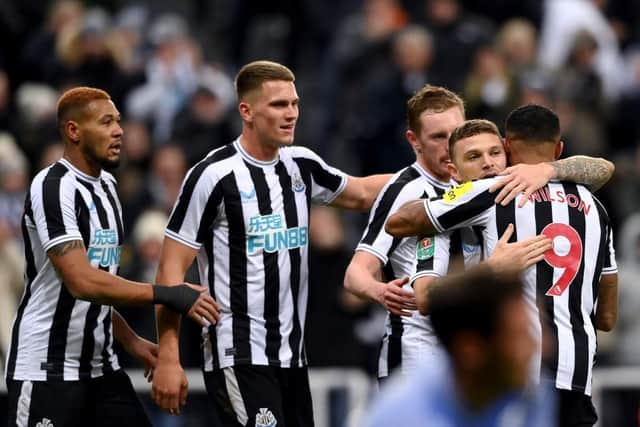 Callum Wilson, Joelinton, Kieran Trippier and Sean Longstaff of Newcastle United celebrate after Adam Smith (not in frame) of AFC Bournemouth scores an own goal during the Carabao Cup Fourth Round match between Newcastle United and AFC Bournemouth at St James' Park on December 20, 2022 in Newcastle upon Tyne, England. (Photo by Stu Forster/Getty Images)