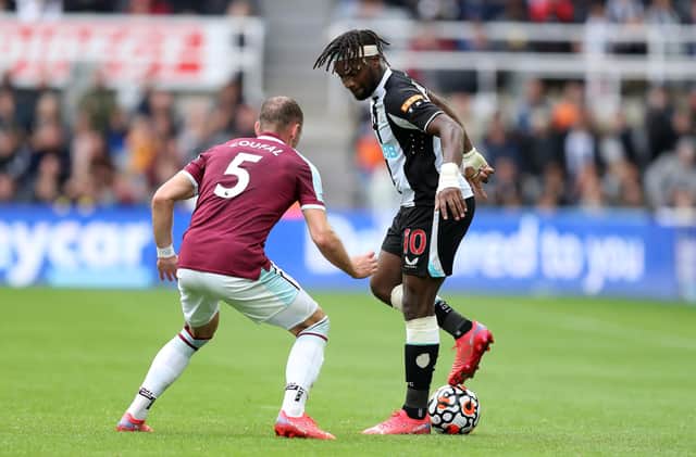 NEWCASTLE UPON TYNE, ENGLAND - AUGUST 15: Allan Saint-Maximin of Newcastle United battles for possession with Vladimir Coufal of West Ham United during the Premier League match between Newcastle United and West Ham United at St. James Park on August 15, 2021 in Newcastle upon Tyne, England. (Photo by George Wood/Getty Images)
