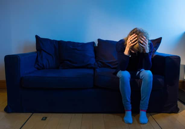 PICTURE POSED BY MODEL A woman showing signs of depression.