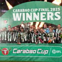 Newcastle United's Bruno Guimaraes and Kieran Trippier lift the Carabao Cup trophy with team-mates following victory at Wembley Stadium over Liverpool. (Photo by Owen Humphreys/PA Wire)