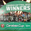 Newcastle United's Bruno Guimaraes and Kieran Trippier lift the Carabao Cup trophy with team-mates following victory at Wembley Stadium over Liverpool. (Photo by Owen Humphreys/PA Wire)