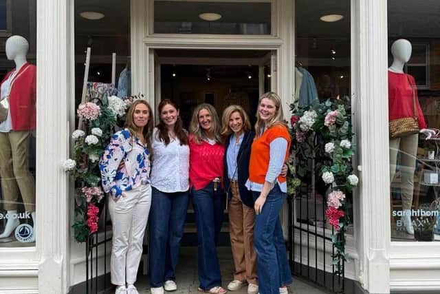 Sarah Thomson (L) at her store in Melrose, Scotland