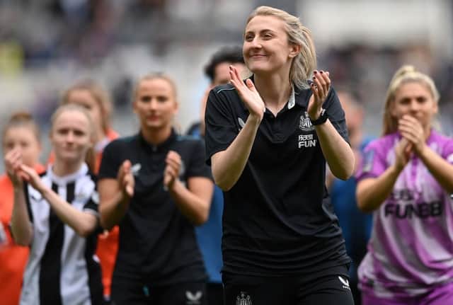 Newcastle United Women head coach Becky Langley applauds fans.