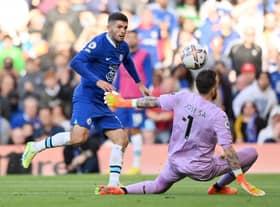 Christian Pulisic of Chelsea scores their side's second goal past Jose Sa of Wolverhampton Wanderers during the Premier League match between Chelsea FC and Wolverhampton Wanderers at Stamford Bridge on October 08, 2022 in London, England. (Photo by Justin Setterfield/Getty Images)