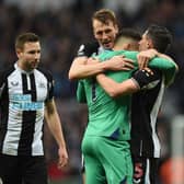 Newcastle United's Welsh defender Paul Dummett (L), Newcastle United's English defender Dan Burn (2nd L), Newcastle United's Slovakian goalkeeper Martin Dubravka (2nd R) and Newcastle United's Swiss defender Fabian Schar (R) celebrate on the pitch after the English Premier League football match between Newcastle United and Aston Villa at St James' Park in Newcastle-upon-Tyne, north east England on February 13, 2022. 