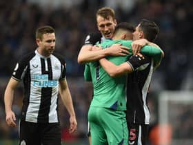Newcastle United's Welsh defender Paul Dummett (L), Newcastle United's English defender Dan Burn (2nd L), Newcastle United's Slovakian goalkeeper Martin Dubravka (2nd R) and Newcastle United's Swiss defender Fabian Schar (R) celebrate on the pitch after the English Premier League football match between Newcastle United and Aston Villa at St James' Park in Newcastle-upon-Tyne, north east England on February 13, 2022. 