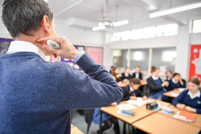 A teacher in a maths class at Royal High School Bath, which is a day and boarding school for girls aged 3-18 and also part of The Girls' Day School Trust, the leading network of independent girls' schools in the UK.