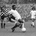 Newcastle United defender Frank Clark tackles Pele during the challenge match in Hong Kong. Pic courtesy of Paul Joannou/NUFC archive.