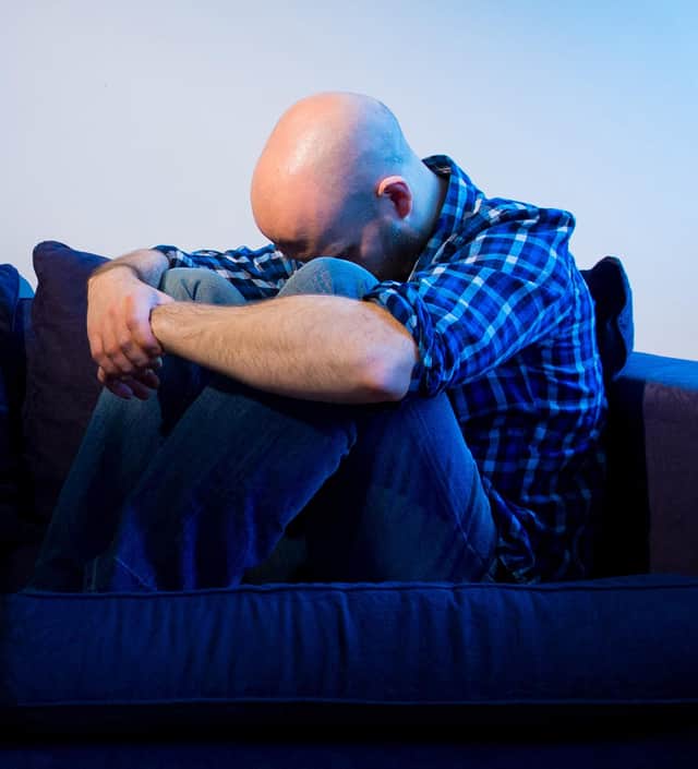 PICTURE POSED BY MODEL A man showing signs of depression.