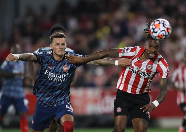 Ivan Toney of Brentford is challenged by Ben White of Arsenal during the Premier League match between Brentford  and  Arsenal at Brentford Community Stadium on August 13, 2021 in Brentford, England. (Photo by Eddie Keogh/Getty Images)
