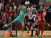 Newcastle United's English goalkeeper Nick Pope catches the ball during the English Premier League football match between Liverpool and Newcastle United at Anfield in Liverpool, north west England on August 31, 2022.  (Photo by PAUL ELLIS/AFP via Getty Images)