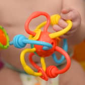 POSED BY A MODEL File photo dated 18/11/2015 of a 9-month-old girl playing with pre-school toys, London. Relatives who step up to look after a child in what is known as kinship care should be given paid leave instead of feeling forced to cut their hours or quit their jobs due to a lack of support, a charity has said. There are more than 162,000 children in England and Wales being raised by either a friend or family member other than their parents, the Kinship organisation said. Issue date: Thursday June 15, 2023.