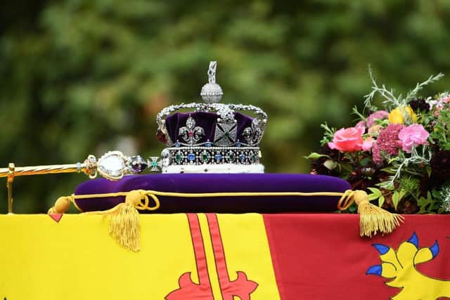 LONDON, ENGLAND - SEPTEMBER 19: The coffin of Queen Elizabeth II with the Imperial State Crown resting on top is carried by the Bearer Party as it departs Westminster Abbey during the State Funeral of Queen Elizabeth II on September 19, 2022 in London, England. Elizabeth Alexandra Mary Windsor was born in Bruton Street, Mayfair, London on 21 April 1926. She married Prince Philip in 1947 and ascended the throne of the United Kingdom and Commonwealth on 6 February 1952 after the death of her Father, King George VI. Queen Elizabeth II died at Balmoral Castle in Scotland on September 8, 2022, and is succeeded by her eldest son, King Charles III. (Photo by Joe Maher/Getty Images)