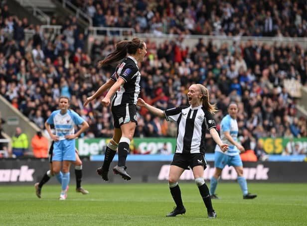<p>Newcastle United Women's captain Brooke Cochrane celebrates with Katie Barker (r) after scoring the second goal from the penalty spot during the FA Women's National League Division One North match against Alnwick Town Ladies at St James' Park on May 01, 2022 in Newcastle upon Tyne, England. (Photo by Stu Forster/Getty Images)</p>