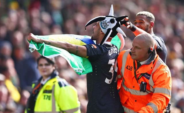 Bruno Guimaraes of Newcastle United celebrates after scoring their side's third goal during the Premier League match between Norwich City and Newcastle United at Carrow Road on April 23, 2022 in Norwich, England. (Photo by Marc Atkins/Getty Images)