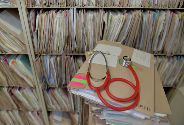 A stethoscope on top of patient's files at the Temple Fortune Health Centre GP Practice near Golders Green, London.