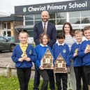 Bellway Sales Manager Chris Lawson, teacher Ashleigh Waite with students at Cheviot Primary