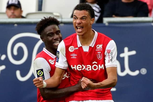 Reims forward Hugo Ekitike, right, celebrates after scoring against Bordeaux in October.
