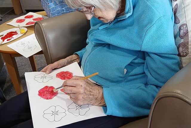 Resident from HC-One’s Falstone Manor Care Home creating poppies for the city’s upcoming VE Day celebrations