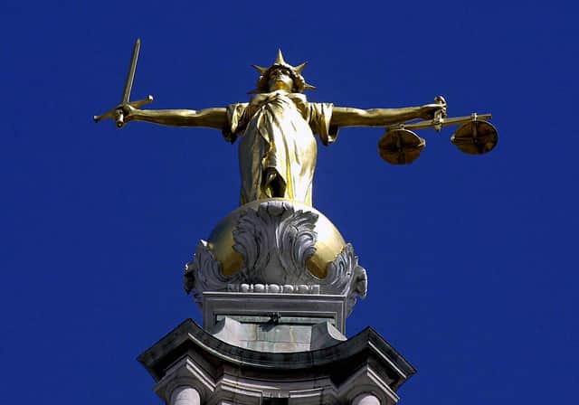 The Scales of Justice on top of the Old Bailey, London.