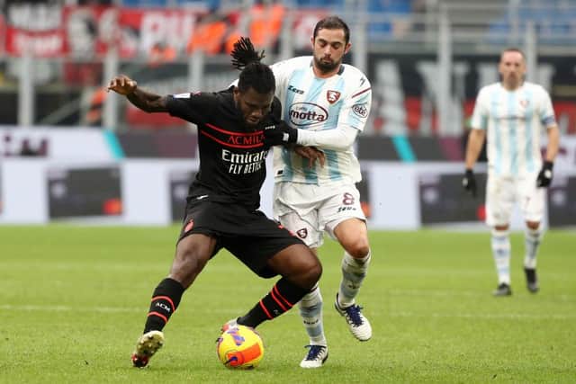 MILAN, ITALY - DECEMBER 04: Franck Kessie of AC Milan battles for possession with Andrea Schiavone of Salernitana  during the Serie A match between AC Milan v US Salernitana at Stadio Giuseppe Meazza on December 04, 2021 in Milan, Italy. (Photo by Marco Luzzani/Getty Images)