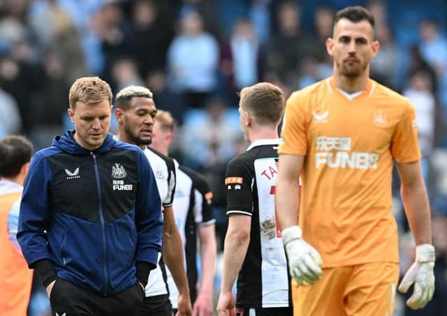 Newcastle United's English head coach Eddie Howe (L) and Newcastle United's Slovakian goalkeeper Martin Dubravka (R) leave the pitch after the English Premier League football match between Manchester City and Newcastle United at the Etihad Stadium in Manchester, north west England, on May 8, 2022. (Photo by PAUL ELLIS/AFP via Getty Images)