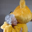 Pusey hugging a Hartford Court resident