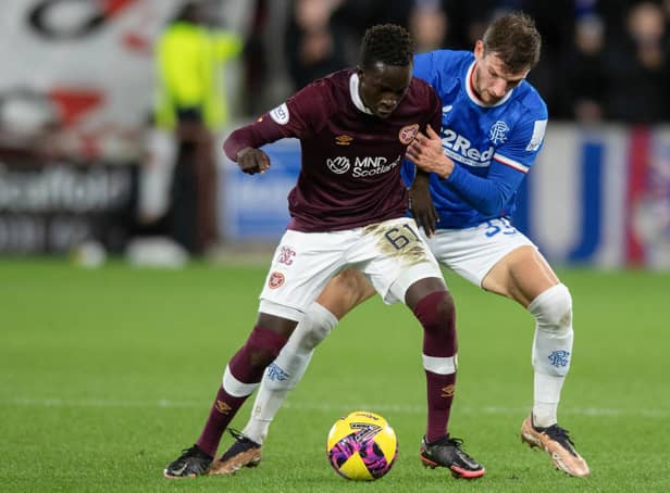 <p>Hearts' Garang Kuol holds off Rangers' Borna Barisic during the match at Tynecastle. (Photo by Mark Scates / SNS Group)</p>