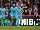 Joelinton of Newcastle United celebrates after scoring their team's first goal during the Premier League match with Brentford. Photo by Luke Walker/Getty Images)