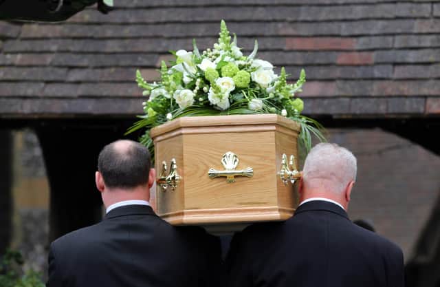 Undated file photo of a funeral taking place. Proposals to improve standards around the sale and design of pre-paid funeral plans, including a ban on cold calling, have been set out by the City regulator. Issue date: Tuesday March 2, 2021.